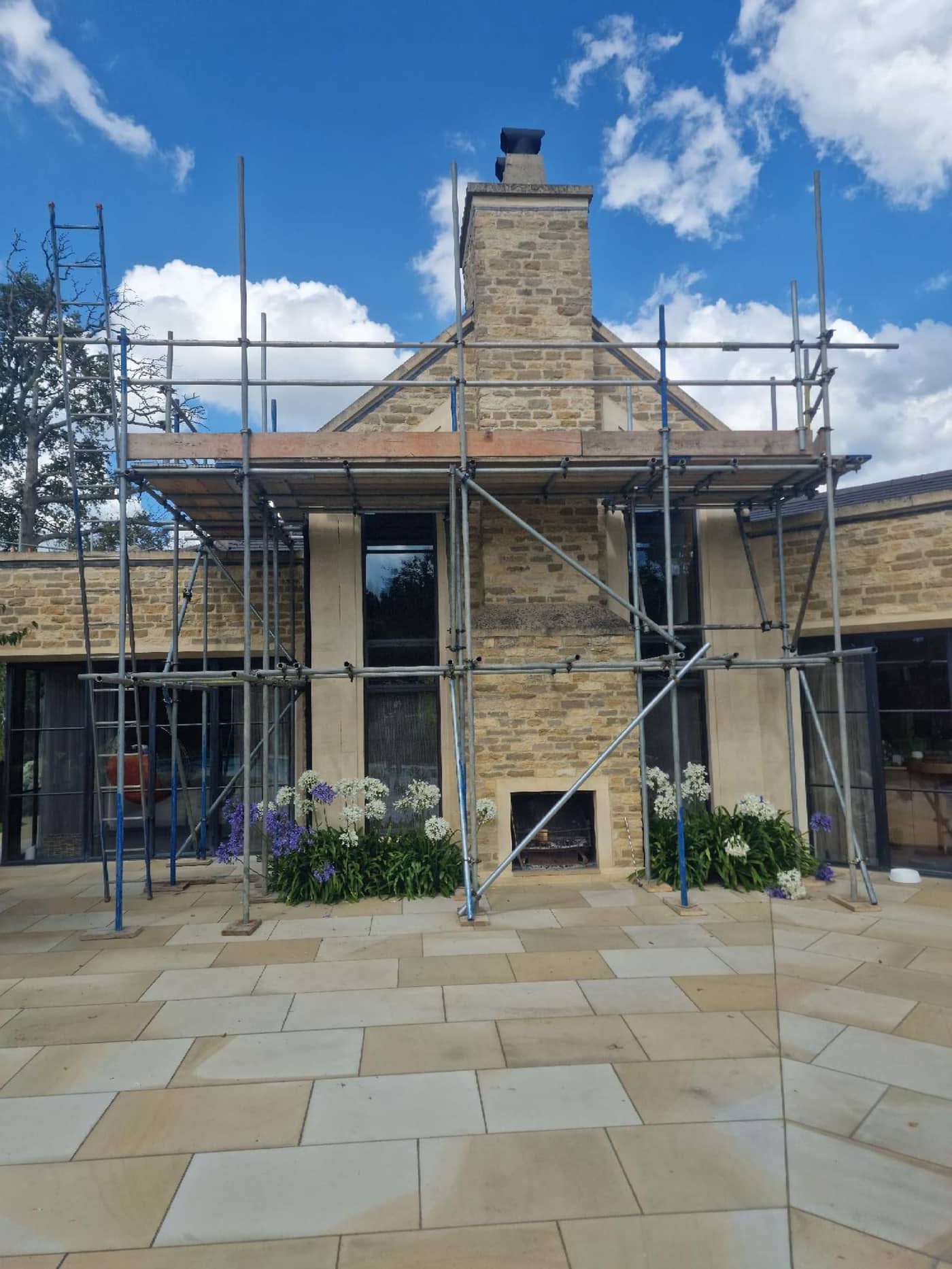 Roof and chimney access scaffold on a stone-built residential property